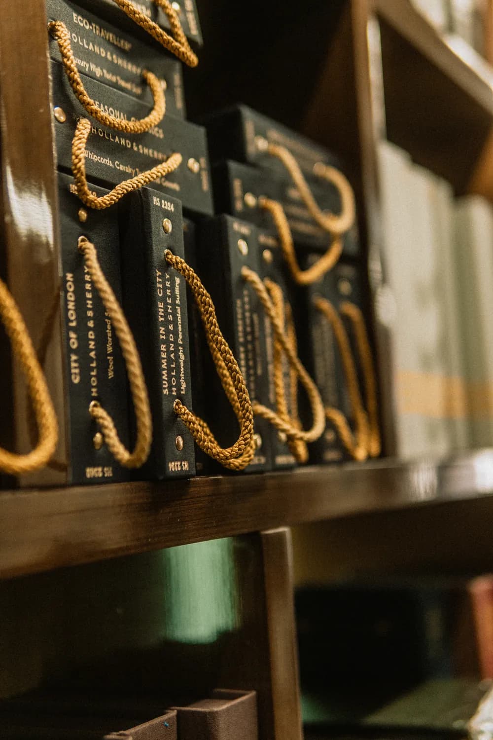 Holland & Sherry fabric books on the shelves of our atelier