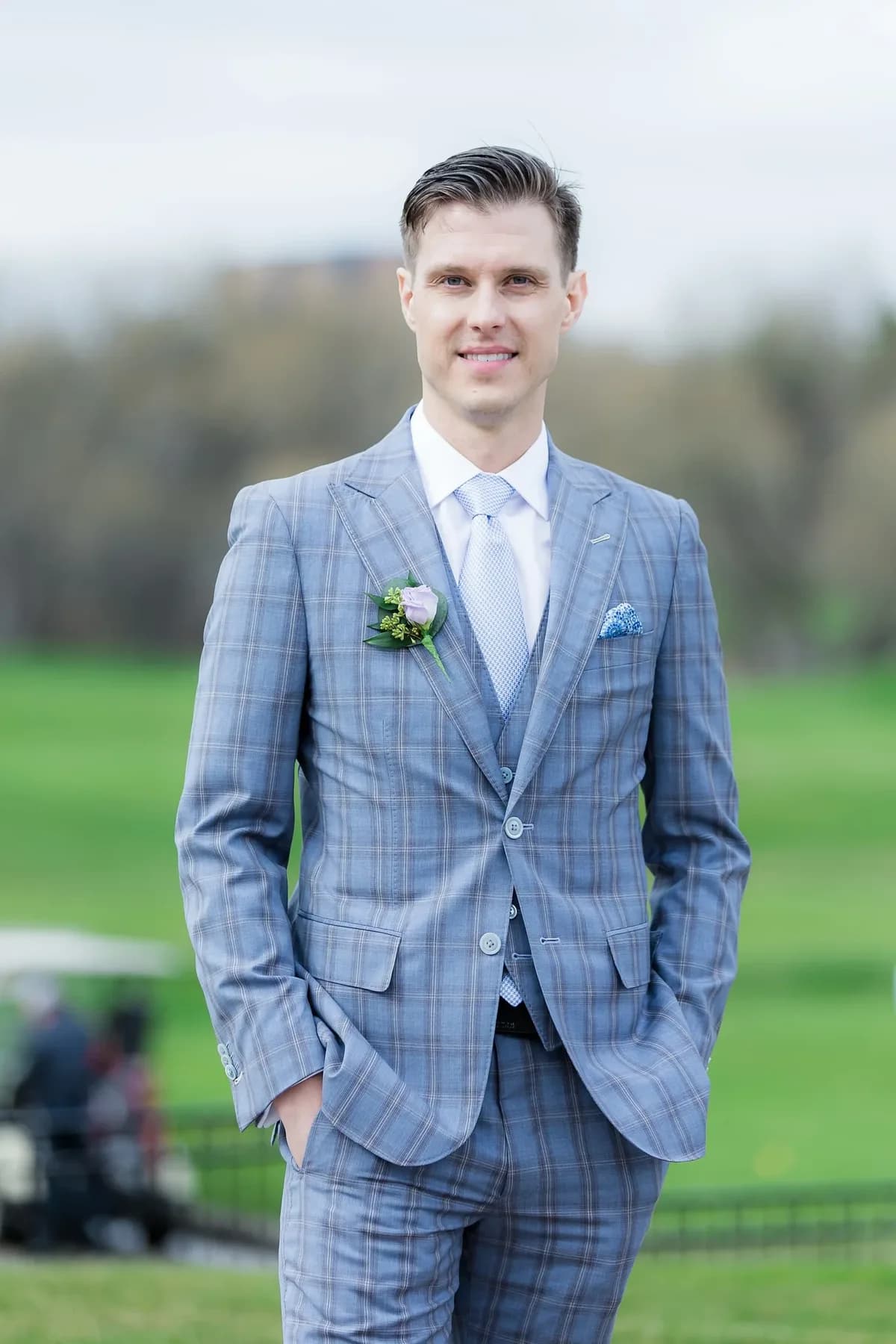 A client wearing a blue checked semi-bespoke suit